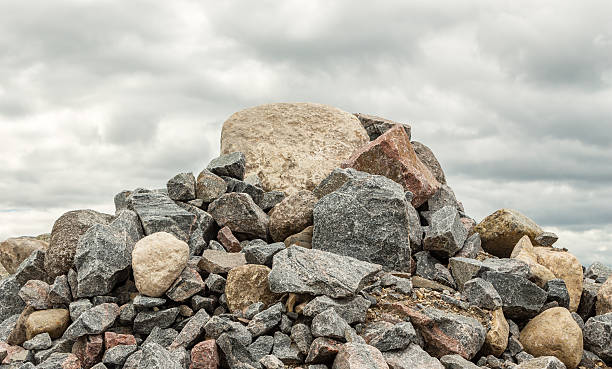 A pile of rocks and a rock

Description automatically generated